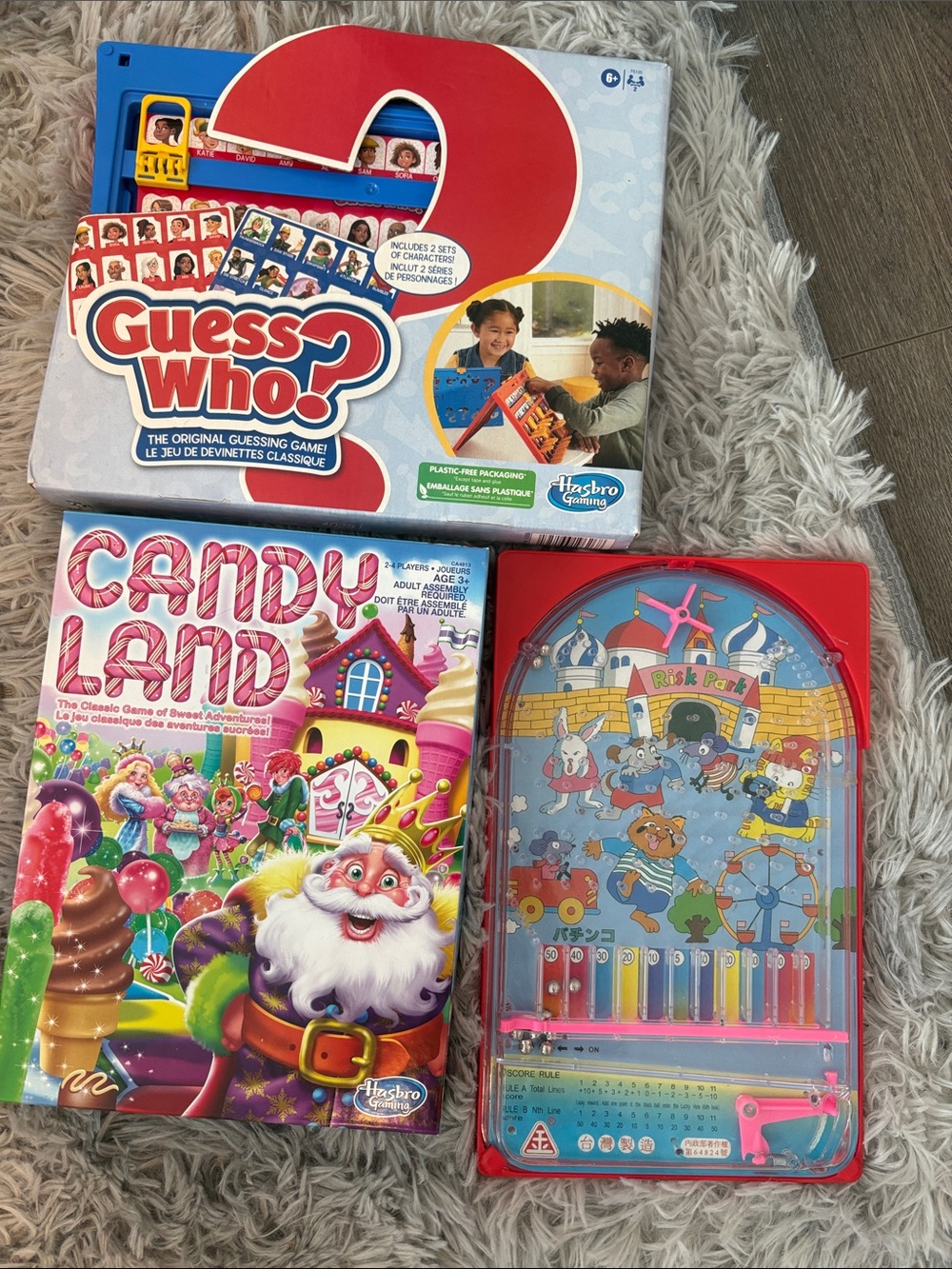 Hasbro Candy Land & Guess Who? Game Boxes with Red Handheld Pachinko